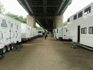 The trailers and dressing rooms.m